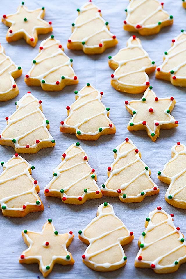 Easy and best sugar cookie recipe with Christmas sugar cookies cut out from the cookie dough.